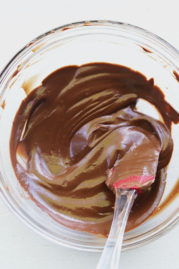 filling in a bowl with a spatula. 