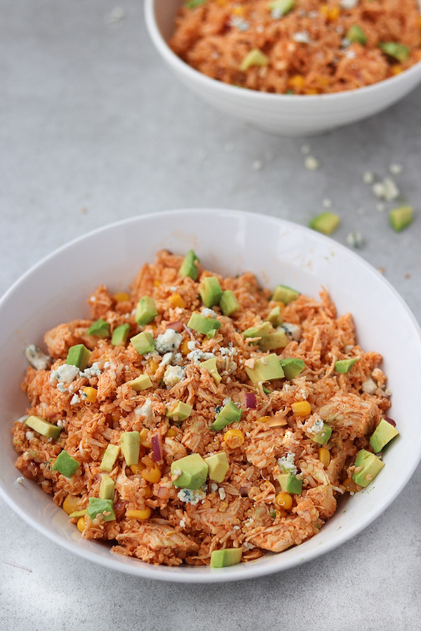 buffalo chicken dip in a bowl with blue cheese.