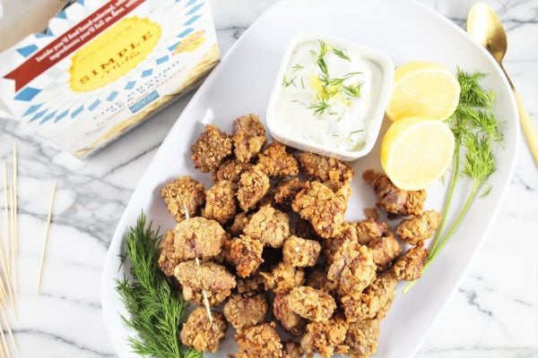 nuggets on a plate with dip.